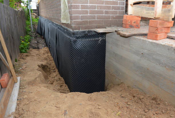 Happy homeowners after waterproofing job in Johnstown